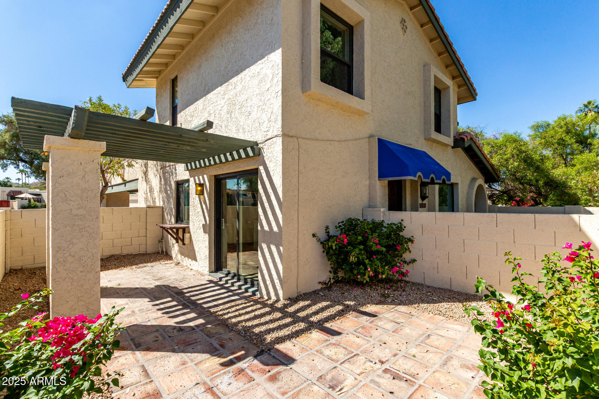8635 South 48th Street, Unit 3 Phoenix, AZ 85044 - Photo 22 of 24 a view of a house with a flower garden