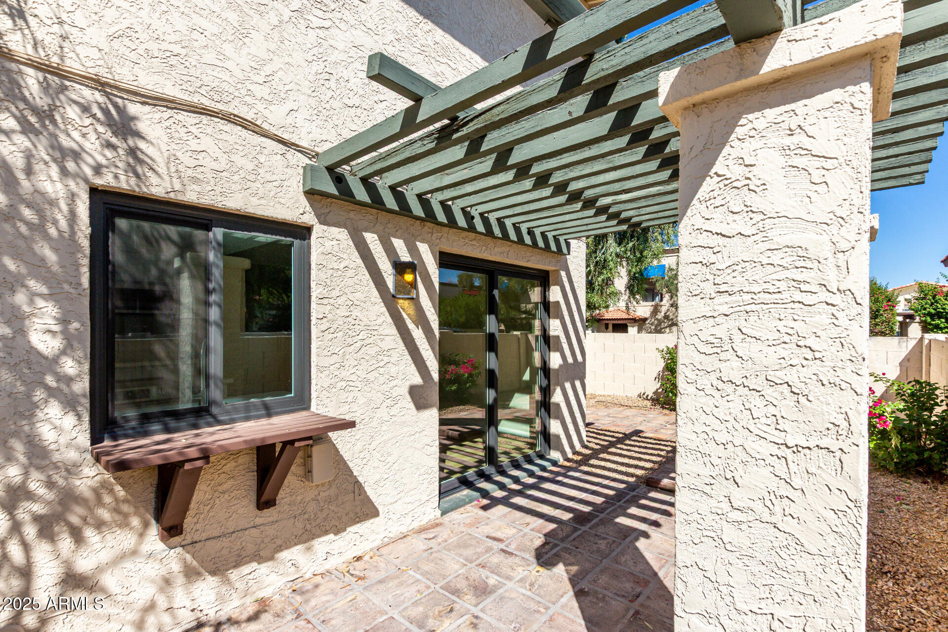 8635 South 48th Street, Unit 3 Phoenix, AZ 85044 - Photo 23 of 24 a view of a patio with a table and chairs