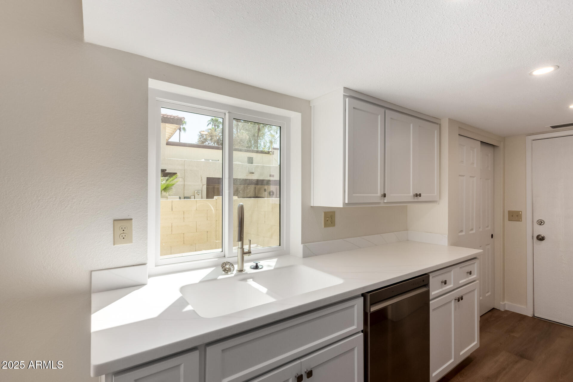 8635 South 48th Street, Unit 3 Phoenix, AZ 85044 - Photo 9 of 24 a kitchen with a sink and cabinets