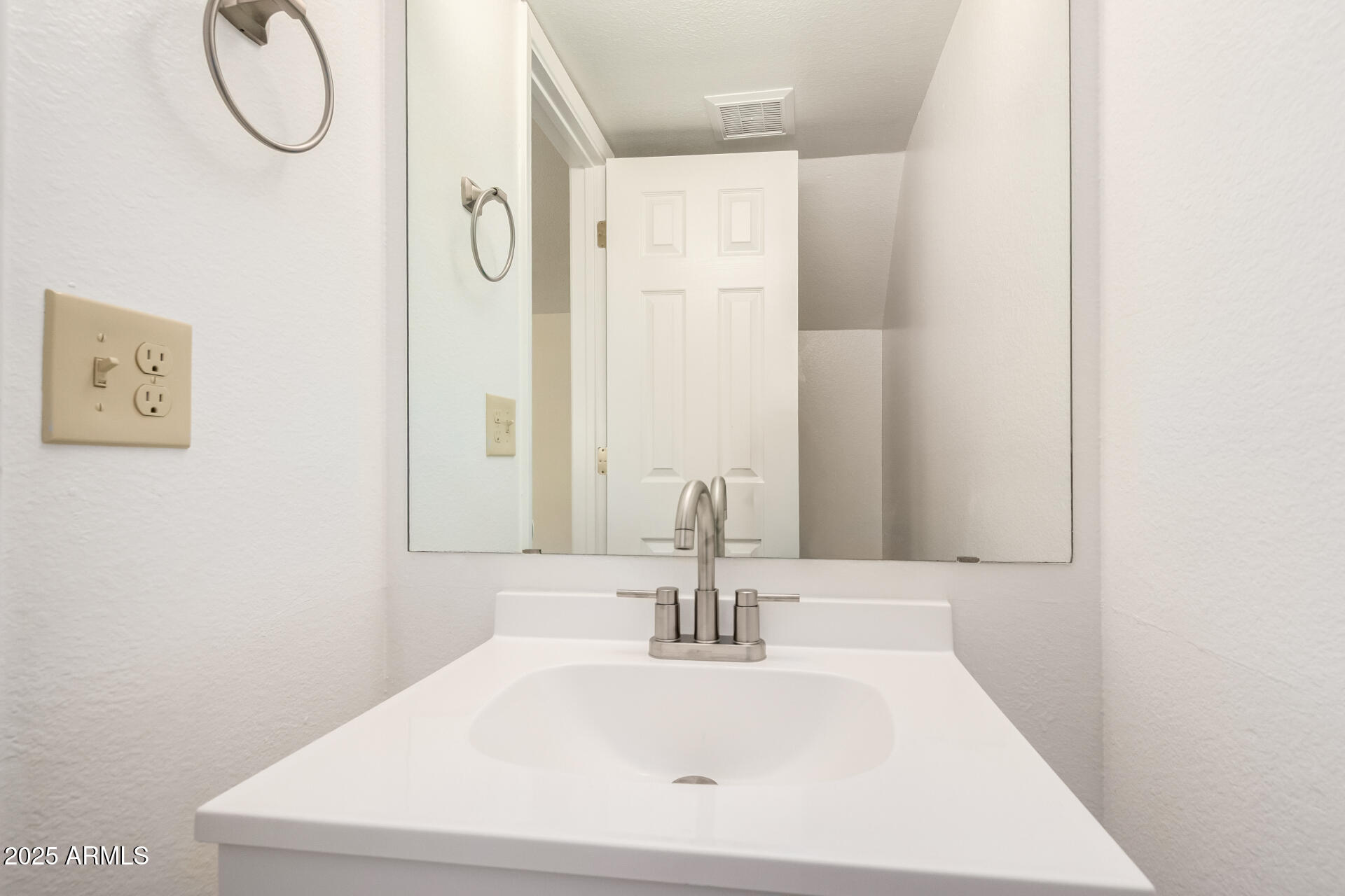 8635 South 48th Street, Unit 3 Phoenix, AZ 85044 - Photo 10 of 24 a bathroom with a sink and a mirror