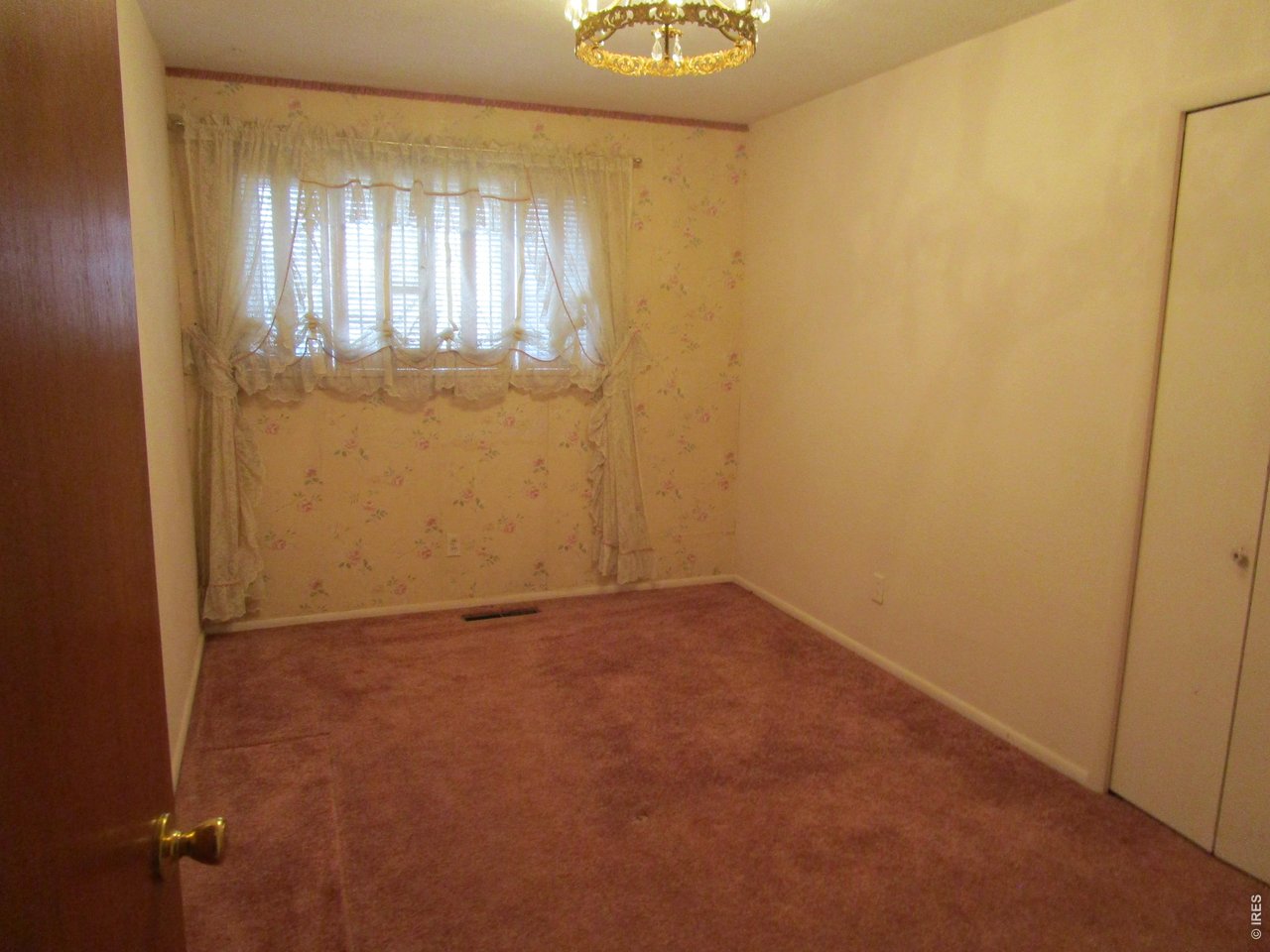 830 15th Street Burlington, CO 80807 - Photo 12 of 21 an empty room with windows