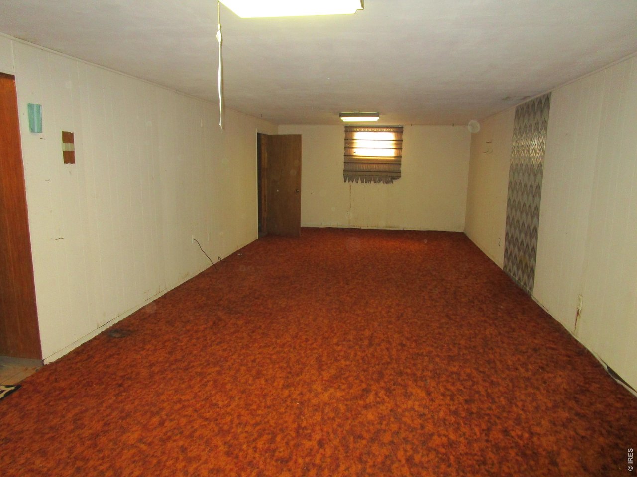 830 15th Street Burlington, CO 80807 - Photo 13 of 21 a view of an empty room and window