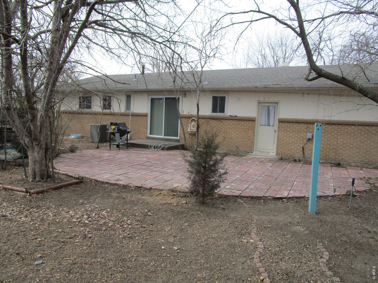 830 15th Street Burlington, CO 80807 - Photo 3 of 21 a front view of a house with garden