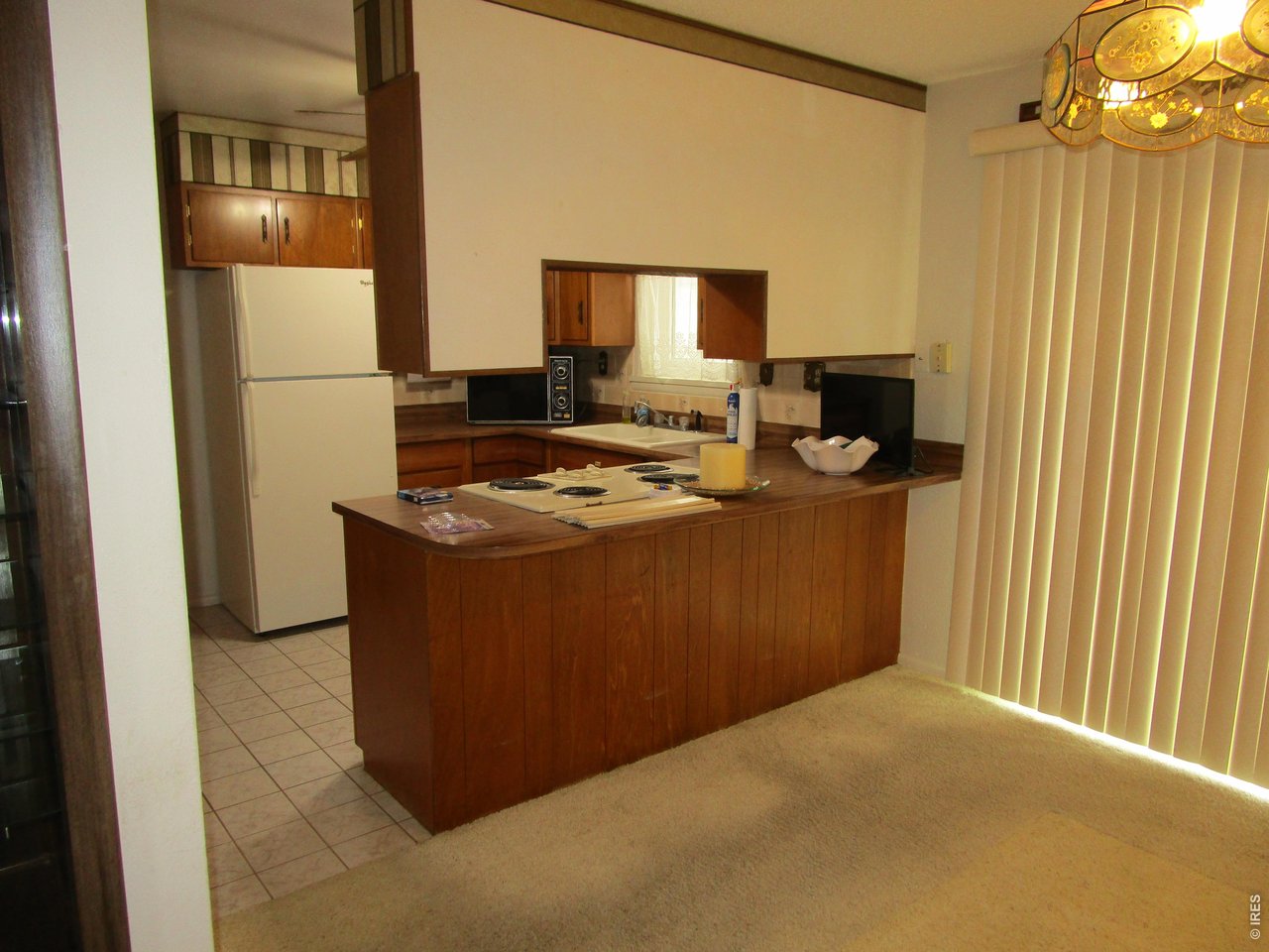 830 15th Street Burlington, CO 80807 - Photo 5 of 21 a room with a table and chairs