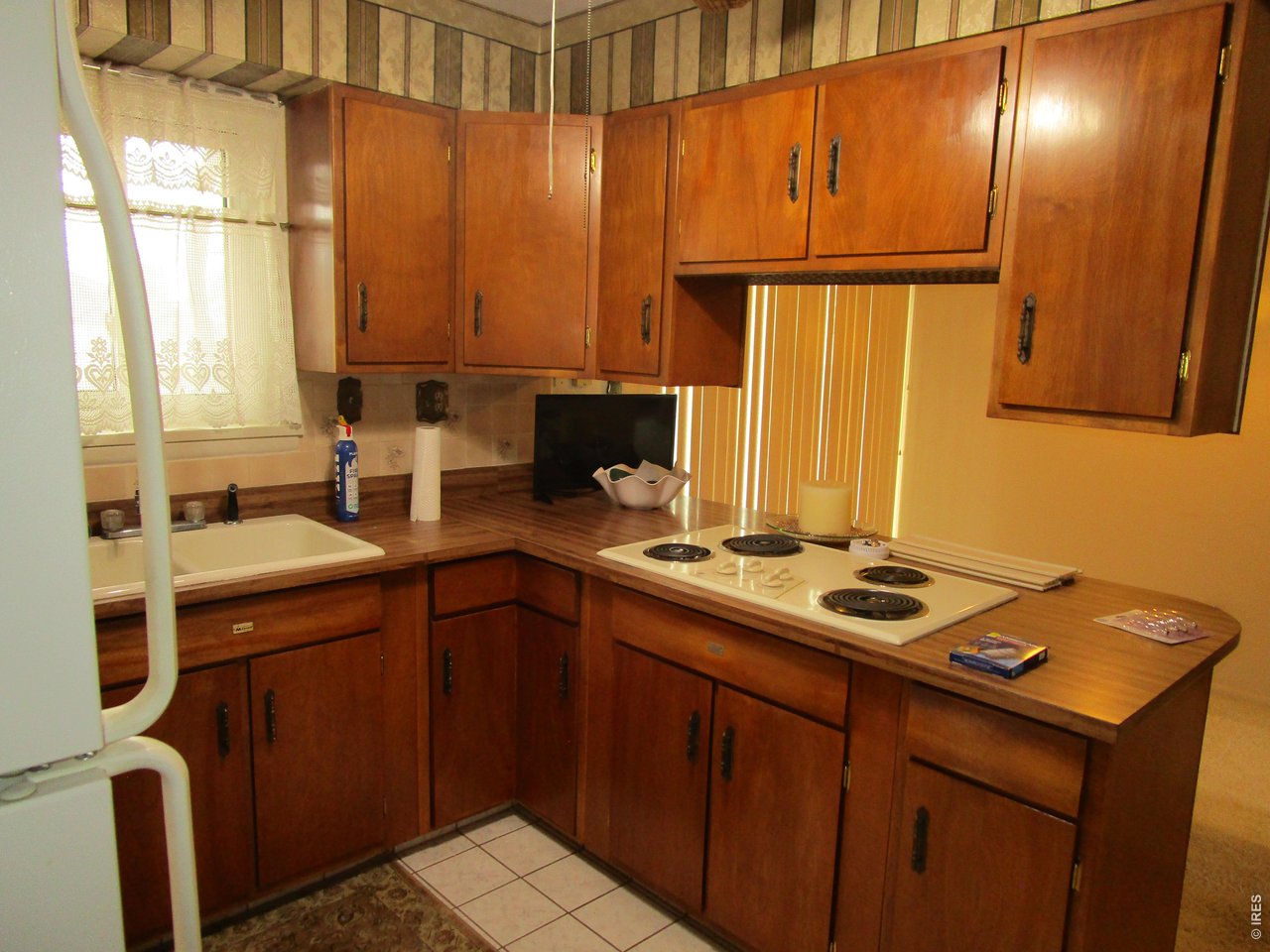 830 15th Street Burlington, CO 80807 - Photo 6 of 21 a kitchen with a sink stove and cabinets
