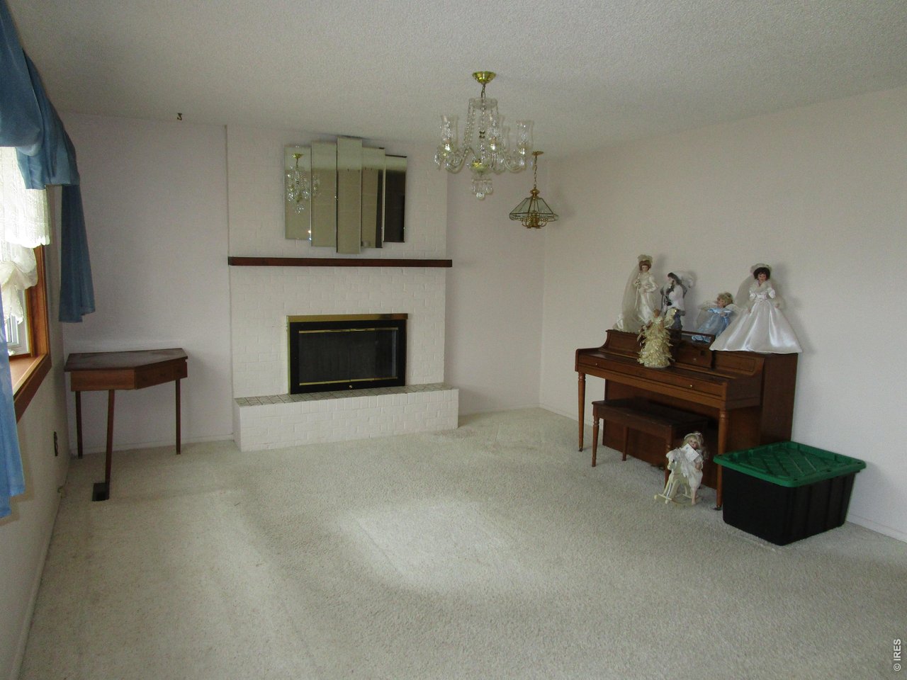 830 15th Street Burlington, CO 80807 - Photo 8 of 21 a living room with furniture and a fireplace