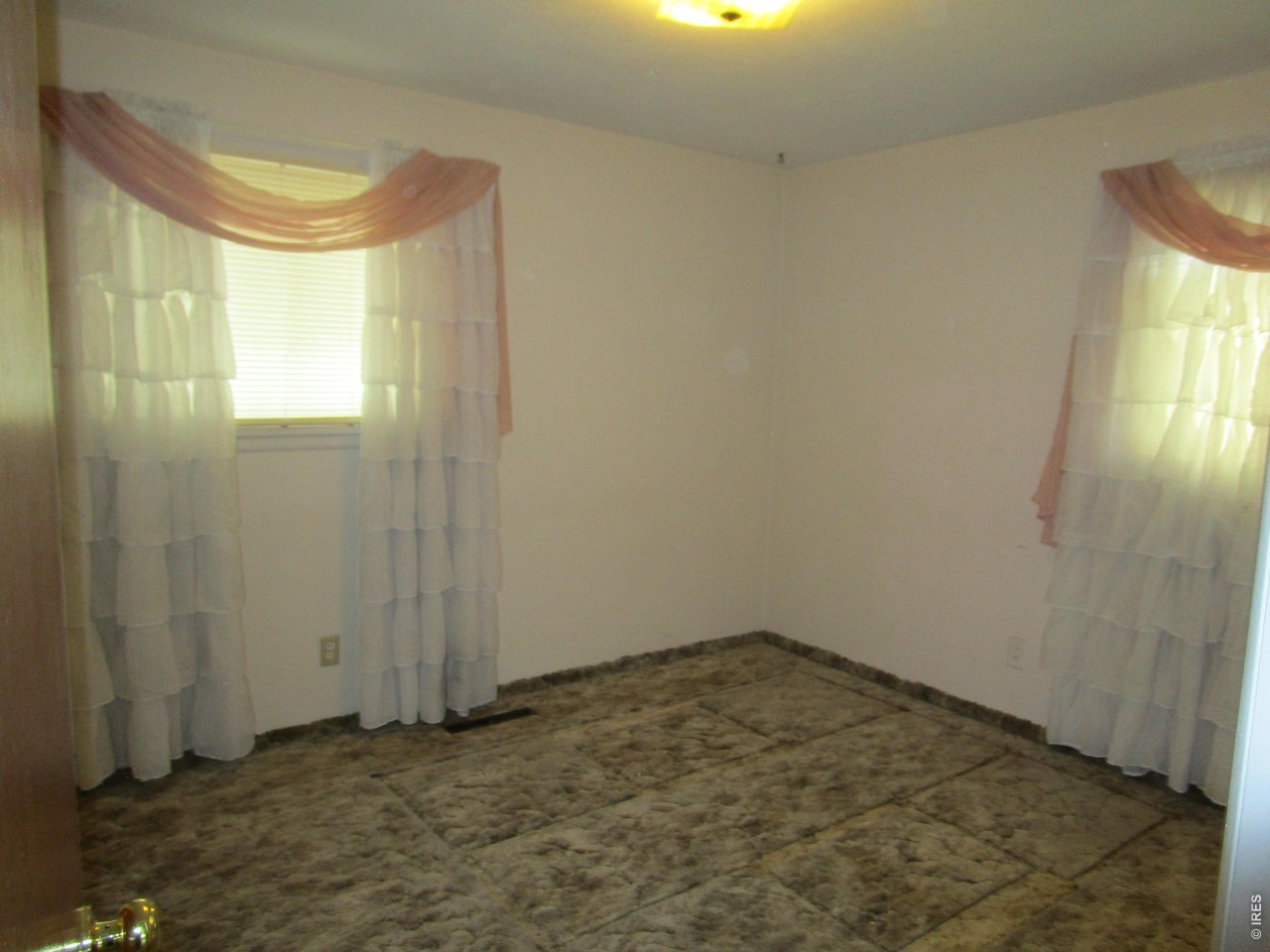 830 15th Street Burlington, CO 80807 - Photo 9 of 21 a view of a room with window