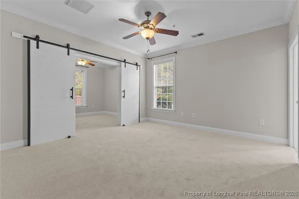 a bathroom with a bathtub and next to window