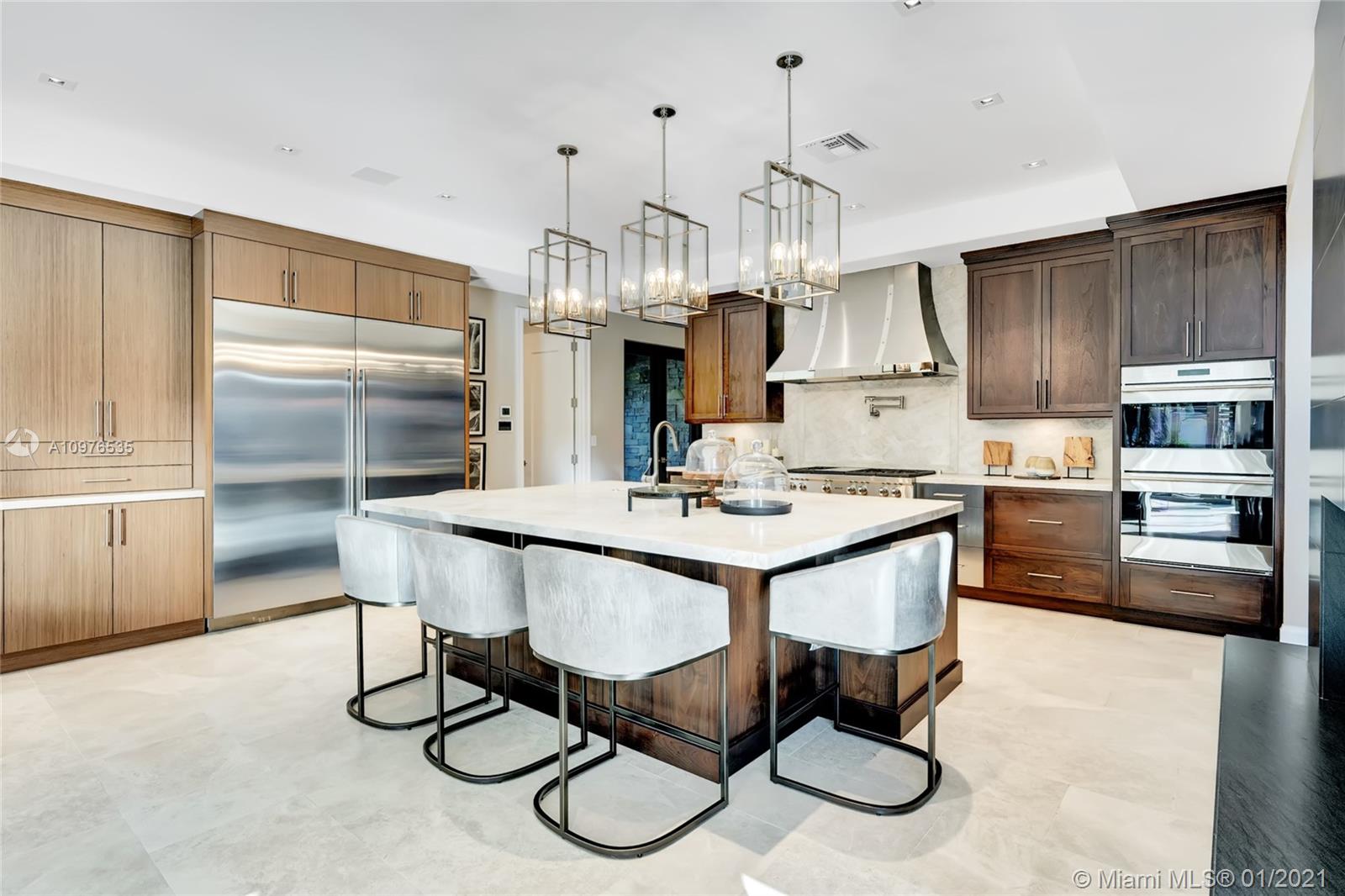 13900 Luray Road Southwest Ranches, FL 33330 - Photo 17 of 50 a kitchen with granite countertop a table chairs stainless steel appliances and cabinets