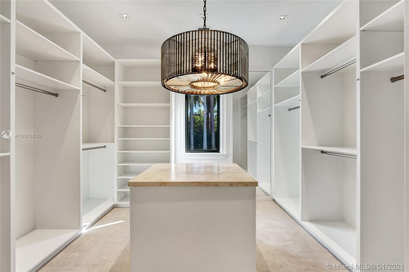 13900 Luray Road Southwest Ranches, FL 33330 - Photo 26 of 50 a kitchen with a sink and a chandelier