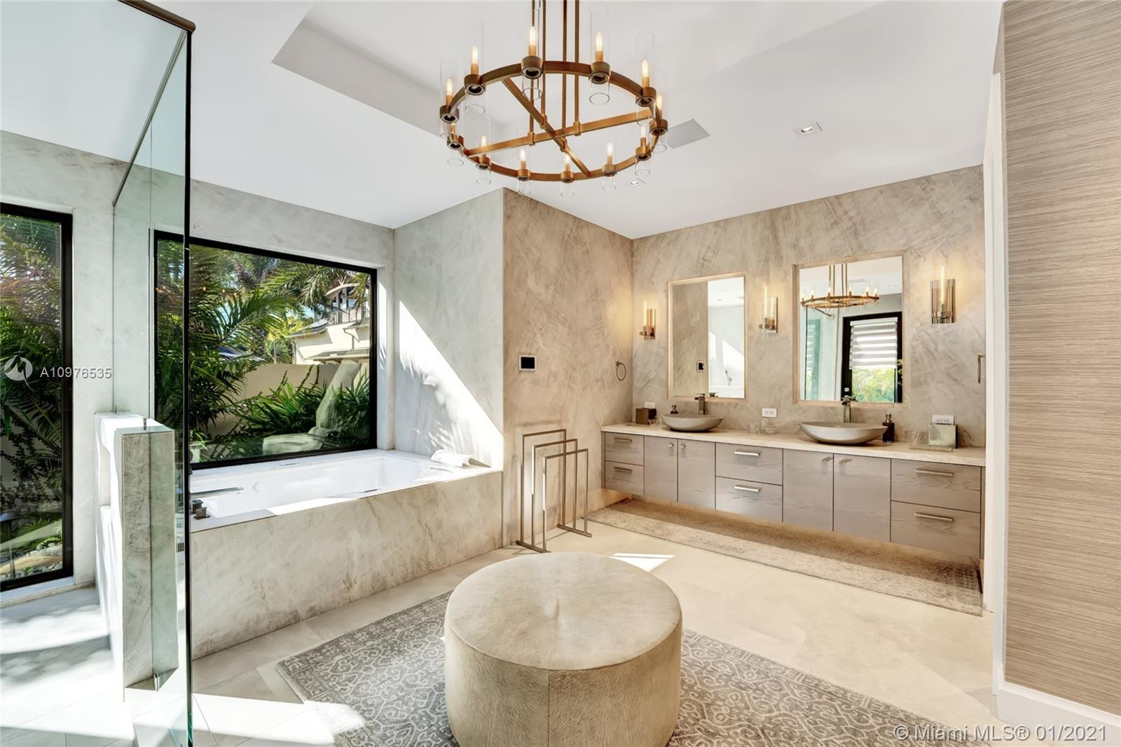 13900 Luray Road Southwest Ranches, FL 33330 - Photo 28 of 50 a large bathroom with a large tub and sink