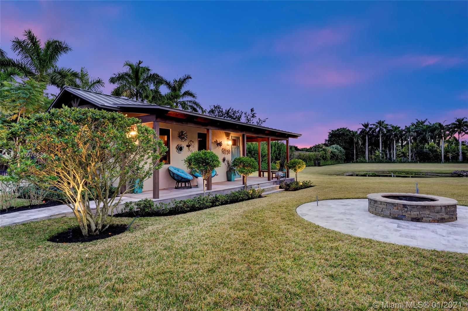 13900 Luray Road Southwest Ranches, FL 33330 - Photo 46 of 50 a view of a backyard with a patio