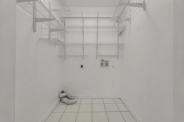 a spacious bathroom with a double vanity sink a large mirror and a shower