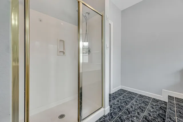 a view of a swimming pool with a patio