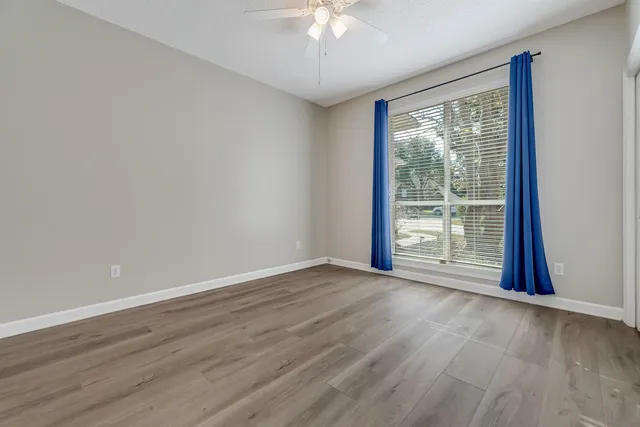 a view of a house with a yard patio and a slide