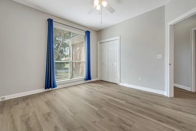 a swimming pool with outdoor seating and yard