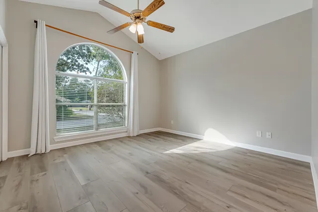 a view of a building with a floor to ceiling windows and a basket ball poll