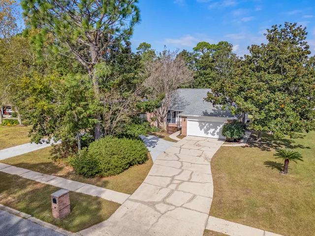 an empty space with wooden floor and ceiling fan