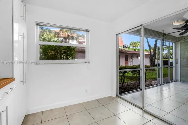 a kitchen with stainless steel appliances granite countertop a sink a stove and cabinets
