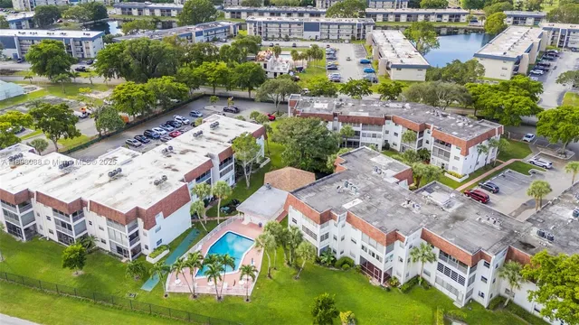 an aerial view of houses with yard