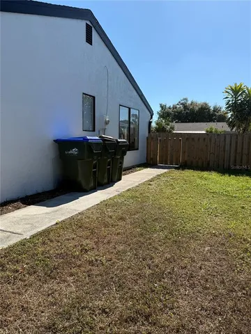 a view of a backyard of the house