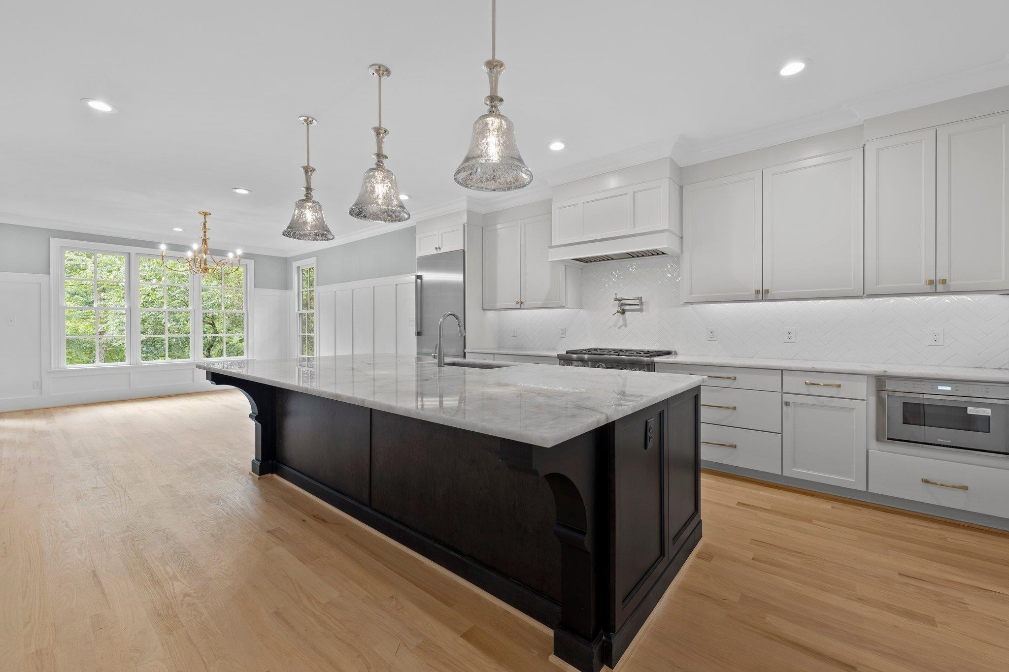 2905 Claremont Road Raleigh, NC 27608 - Photo 5 of 30 You will love this open concept kitchen featuring Thermador Appliances and large island and Quartzite countertops! Kitchen