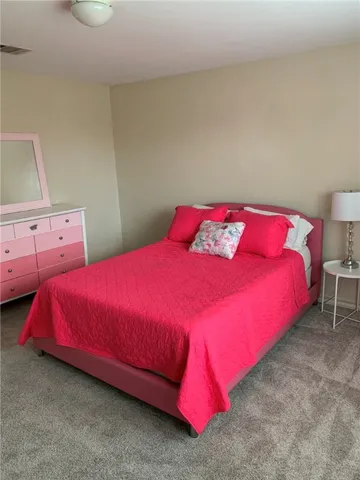 a bedroom with a bed and closet