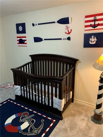 a bedroom with furniture and wooden floor