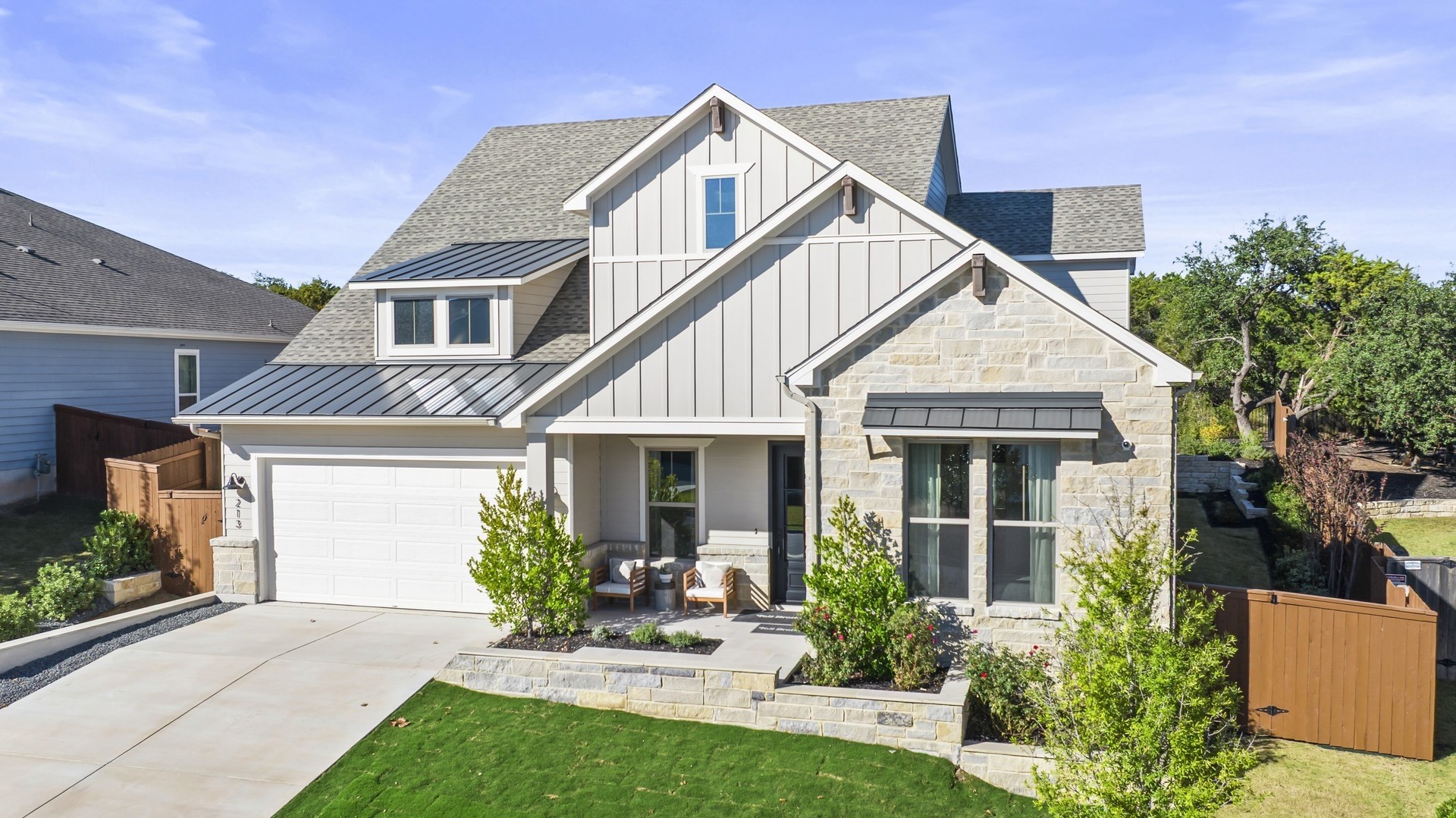 213 Hazy Hills Loop Dripping Springs, TX 78620 - Photo 1 of 1 a view of a house with a yard and potted plants