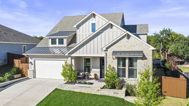 a view of a house with a yard and plants