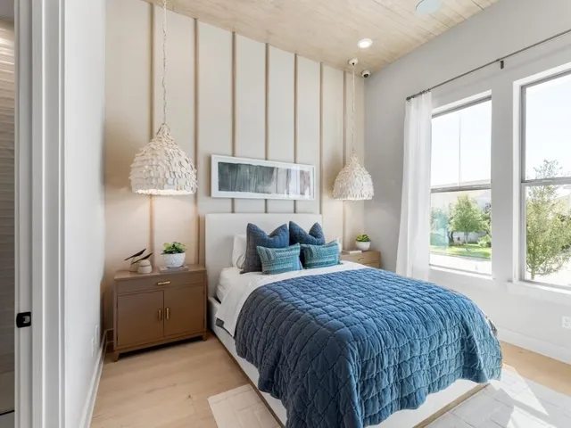 a bedroom with a bed and a window