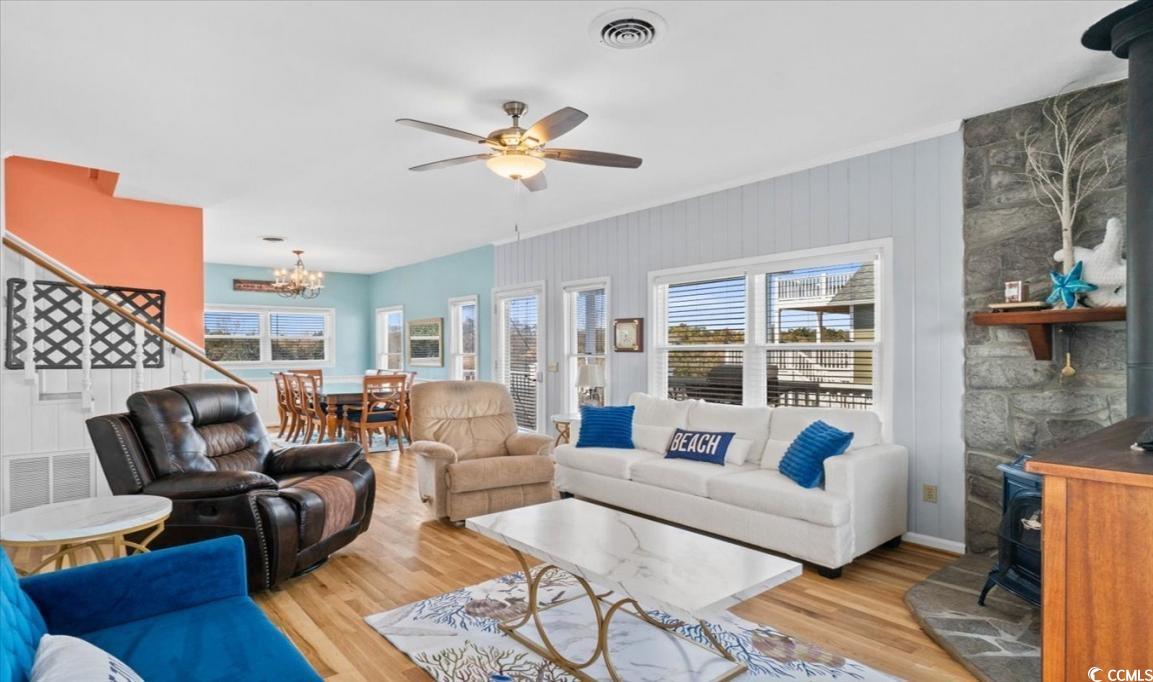 154 SandDollar Drive Holden Beach, NC 28462 - Photo 13 of 39 Living area with a wood stove, plenty of natural l