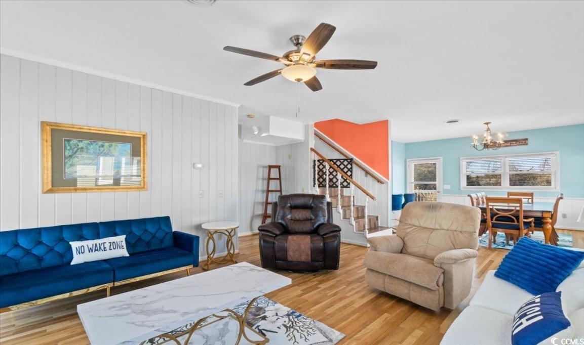 154 SandDollar Drive Holden Beach, NC 28462 - Photo 14 of 39 Living room featuring stairs, wood finished floors