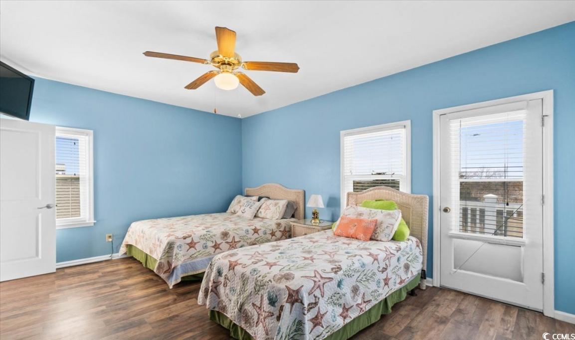 154 SandDollar Drive Holden Beach, NC 28462 - Photo 28 of 39 Bedroom featuring multiple windows, wood finished