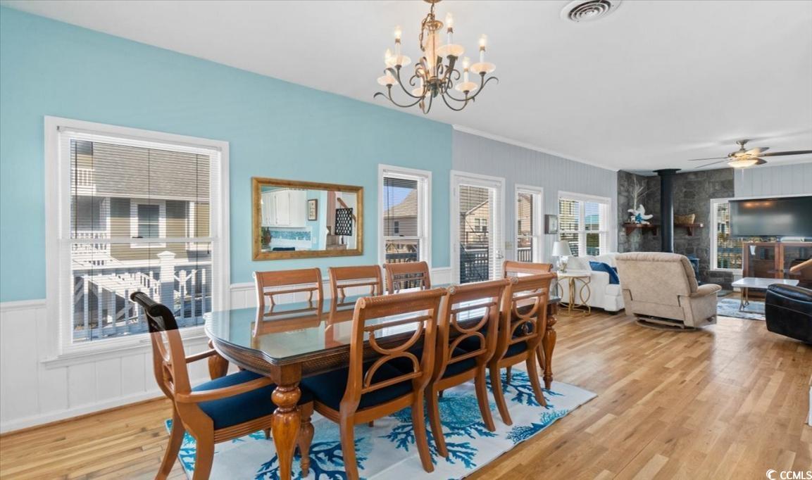 154 SandDollar Drive Holden Beach, NC 28462 - Photo 3 of 39 Dining area with light wood-style flooring, a chan