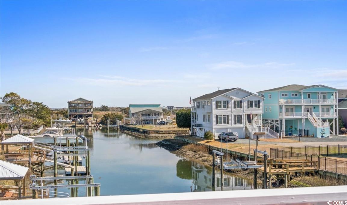 154 SandDollar Drive Holden Beach, NC 28462 - Photo 33 of 39 Dock area featuring a water view, boat lift, and f