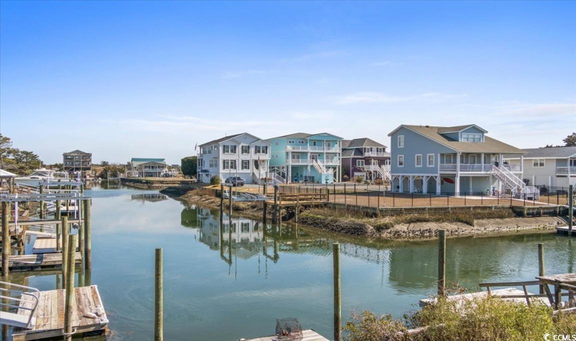 154 SandDollar Drive Holden Beach, NC 28462 - Photo 35 of 39 Dock area featuring a water view and boat lift