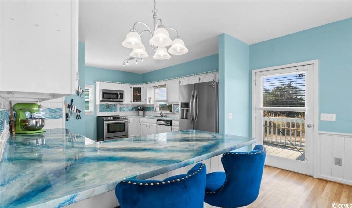 154 SandDollar Drive Holden Beach, NC 28462 - Photo 8 of 39 Kitchen with appliances with stainless steel finis