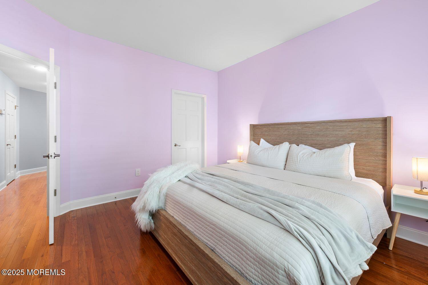 A162 Main Street Manasquan, NJ 08736 - Photo 17 of 41 a bedroom with pink walls and pink rug