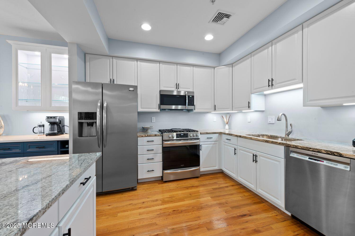 A162 Main Street Manasquan, NJ 08736 - Photo 10 of 41 a kitchen with granite countertop a refrigerator stove top oven and sink