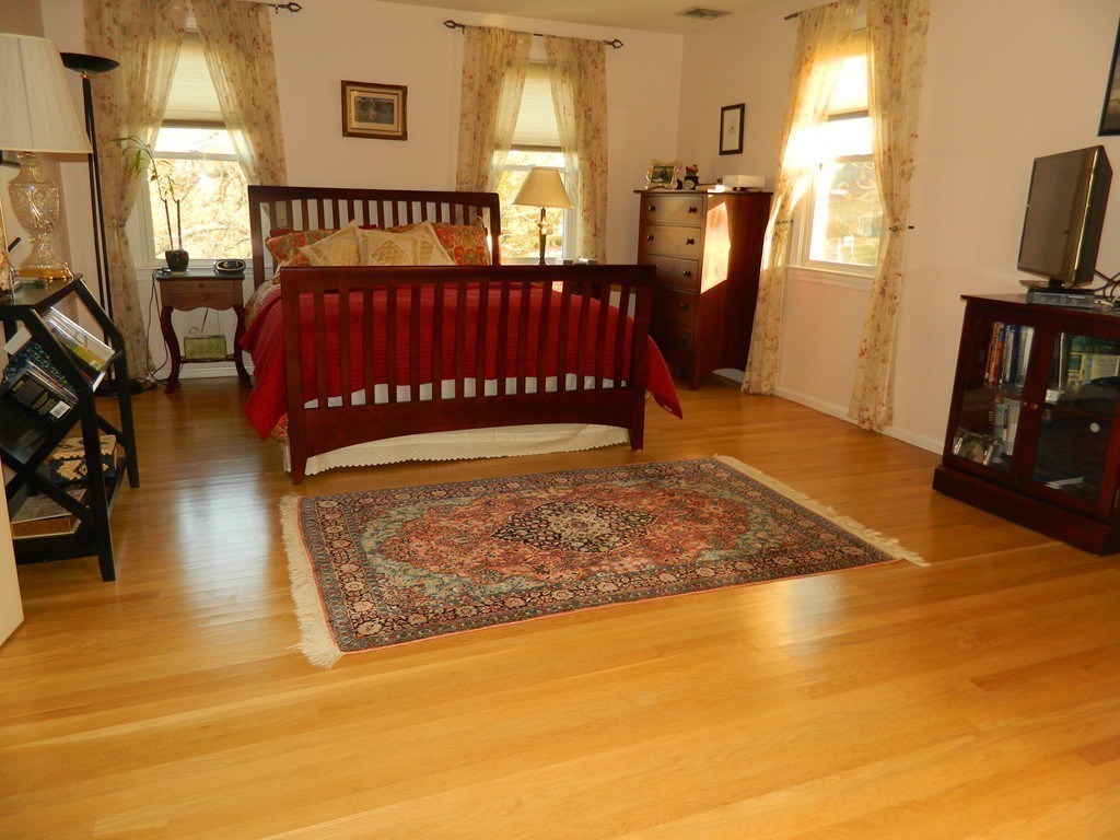 2 Copley Place Canton, MA 02021 - Photo 16 of 28 a view of a bedroom with furniture window and wooden floor