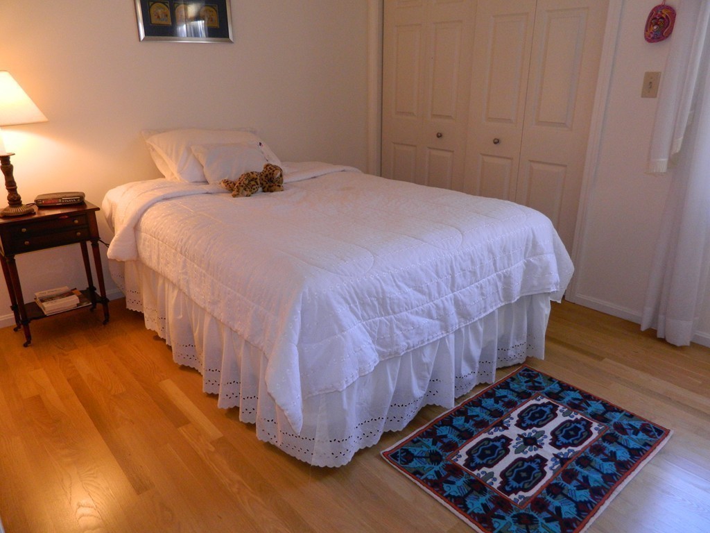2 Copley Place Canton, MA 02021 - Photo 17 of 28 a bedroom with a bed and wooden floor