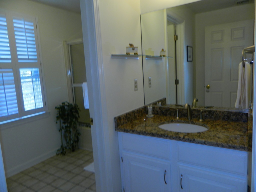 2 Copley Place Canton, MA 02021 - Photo 21 of 28 a bathroom with a granite countertop sink and a mirror