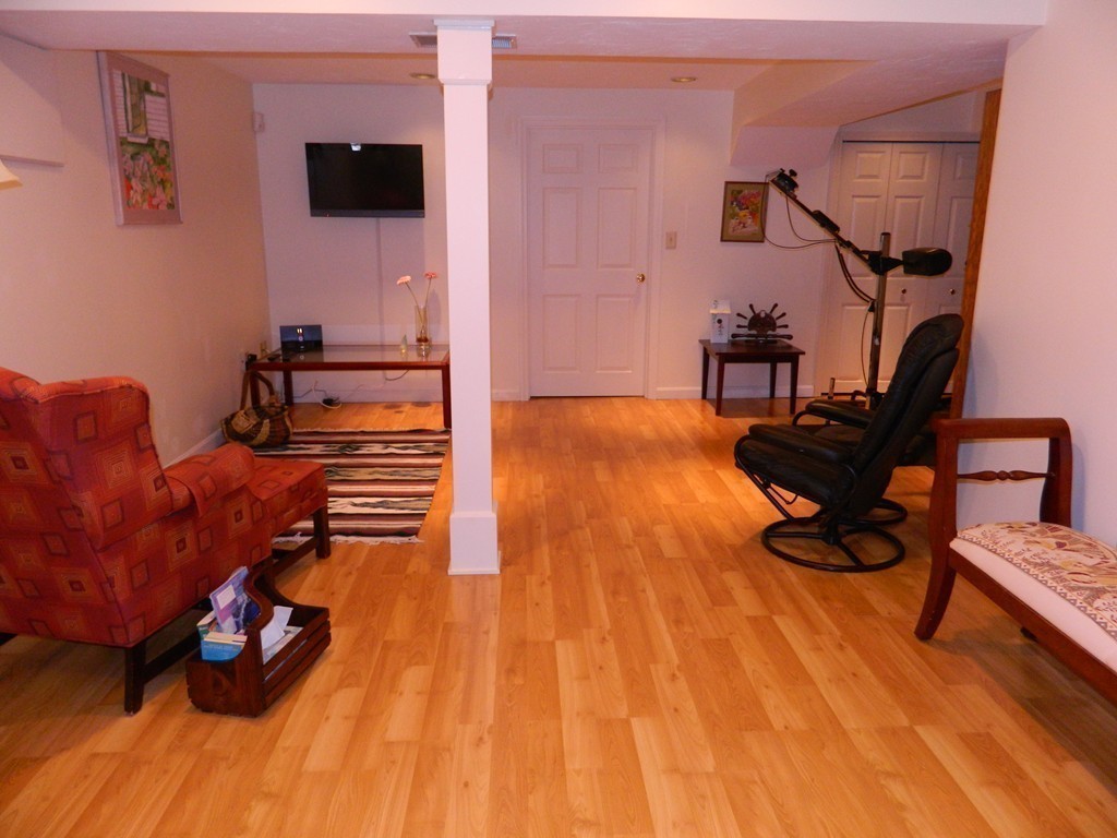 2 Copley Place Canton, MA 02021 - Photo 22 of 28 a living room with furniture and a flat screen tv