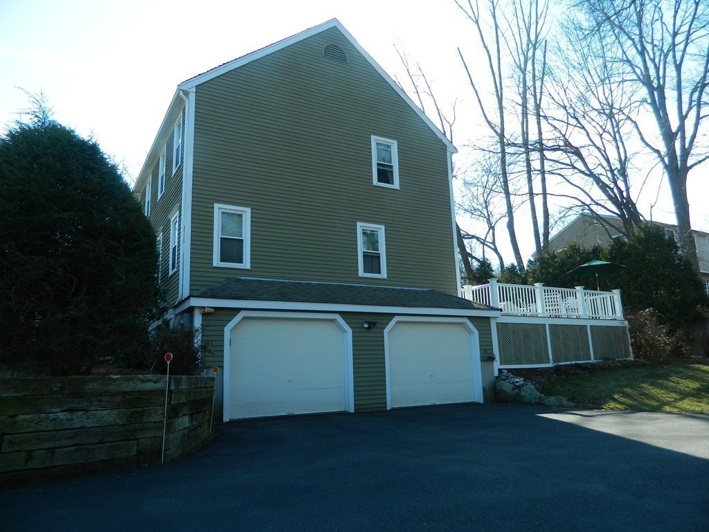 2 Copley Place Canton, MA 02021 - Photo 24 of 28 a front view of a house with a yard