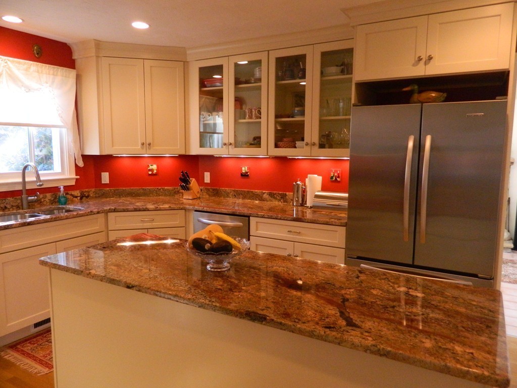 2 Copley Place Canton, MA 02021 - Photo 4 of 28 a kitchen with stainless steel appliances granite countertop a refrigerator and a sink