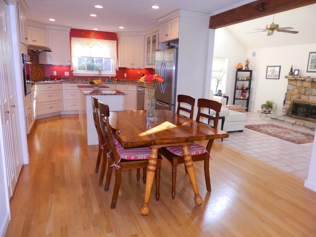 2 Copley Place Canton, MA 02021 - Photo 7 of 28 a dining room with kitchen island a table and chairs