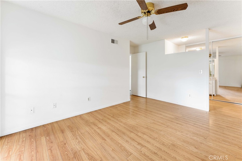 1428 Fredricks Lane Upland, CA 91786 - Photo 13 of 29 a view of empty room with wooden floor