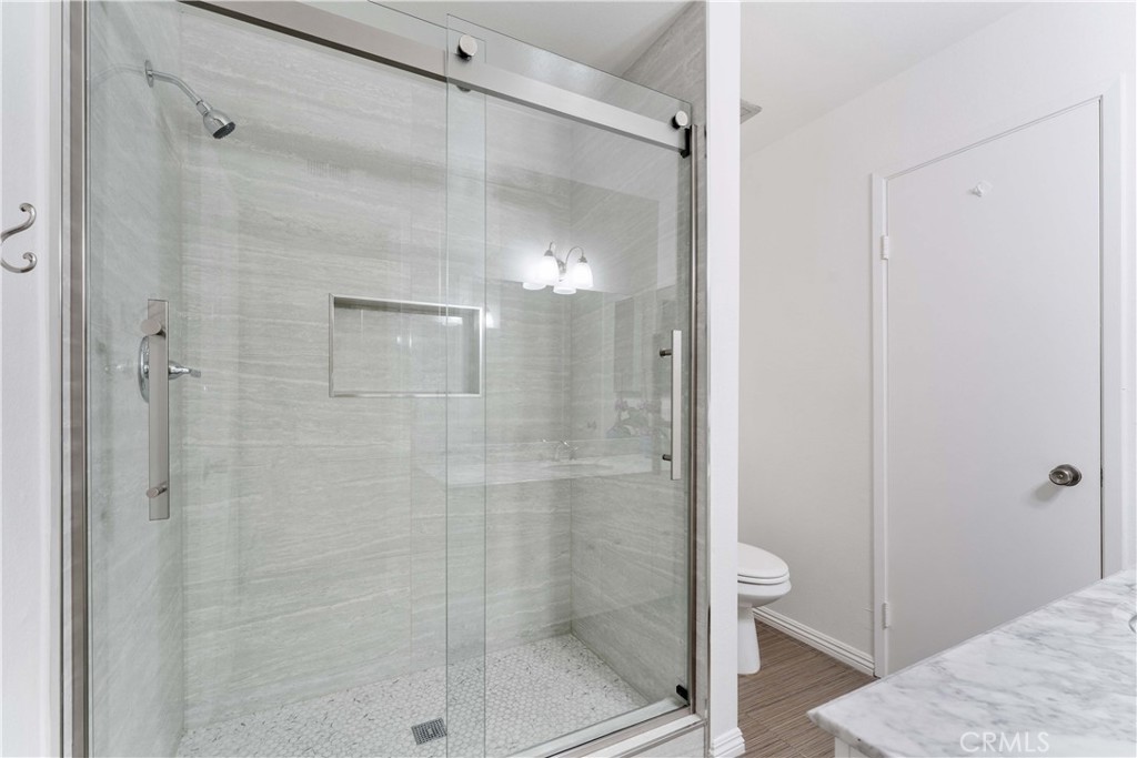 1428 Fredricks Lane Upland, CA 91786 - Photo 19 of 29 a bathroom with a shower and toilet