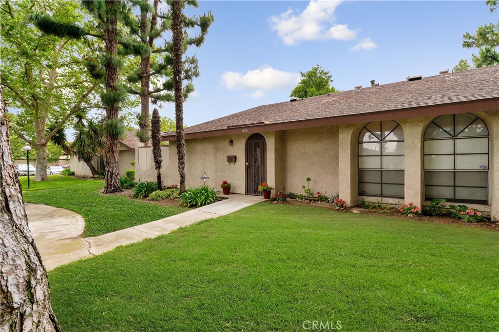 1428 Fredricks Lane Upland, CA 91786 - Photo 2 of 29 a front view of a house with a yard